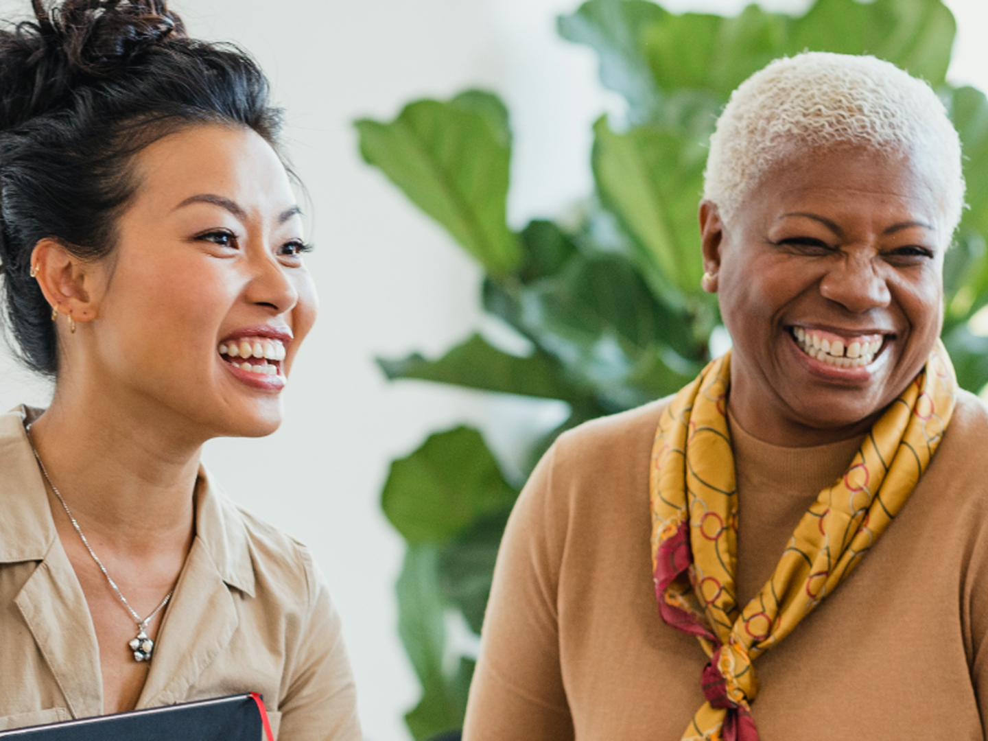 group of diverse women smiling about DEIB at Webster Bank