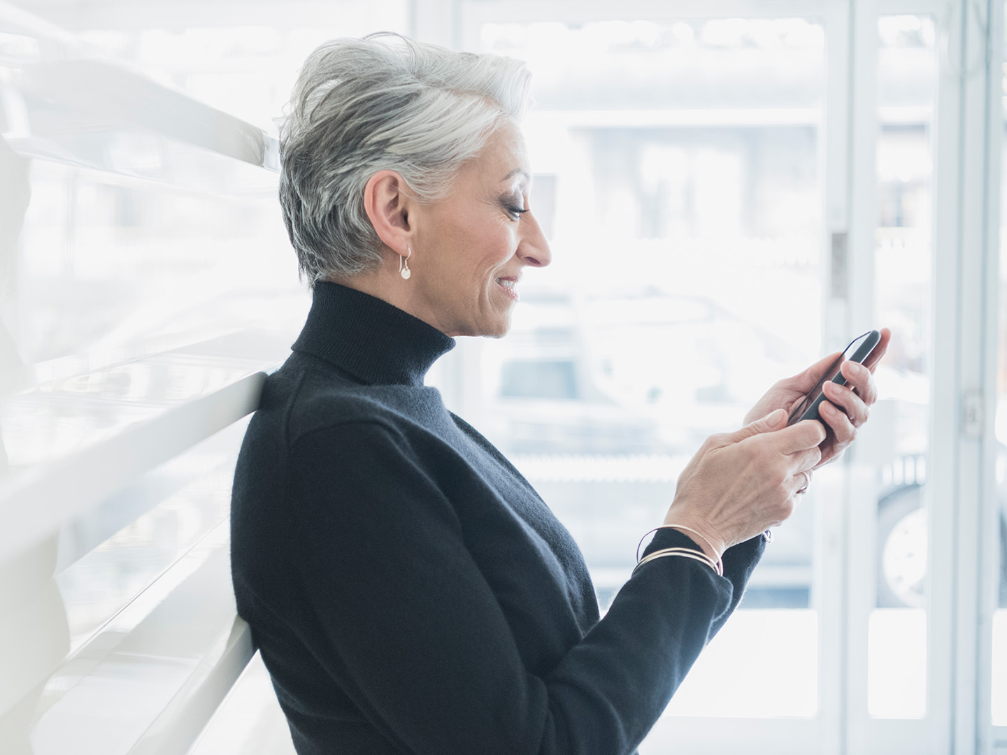 older woman using mobile banking