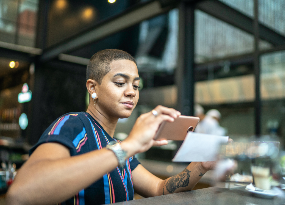 woman depositing check with mobile device