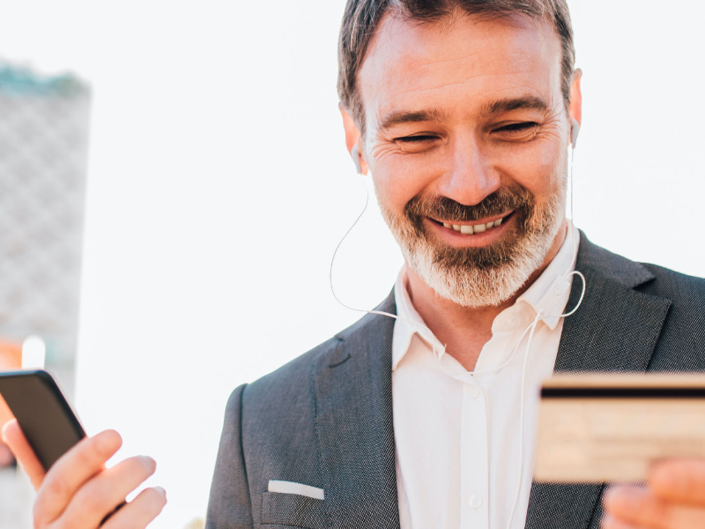 Man using business credit card on mobile app