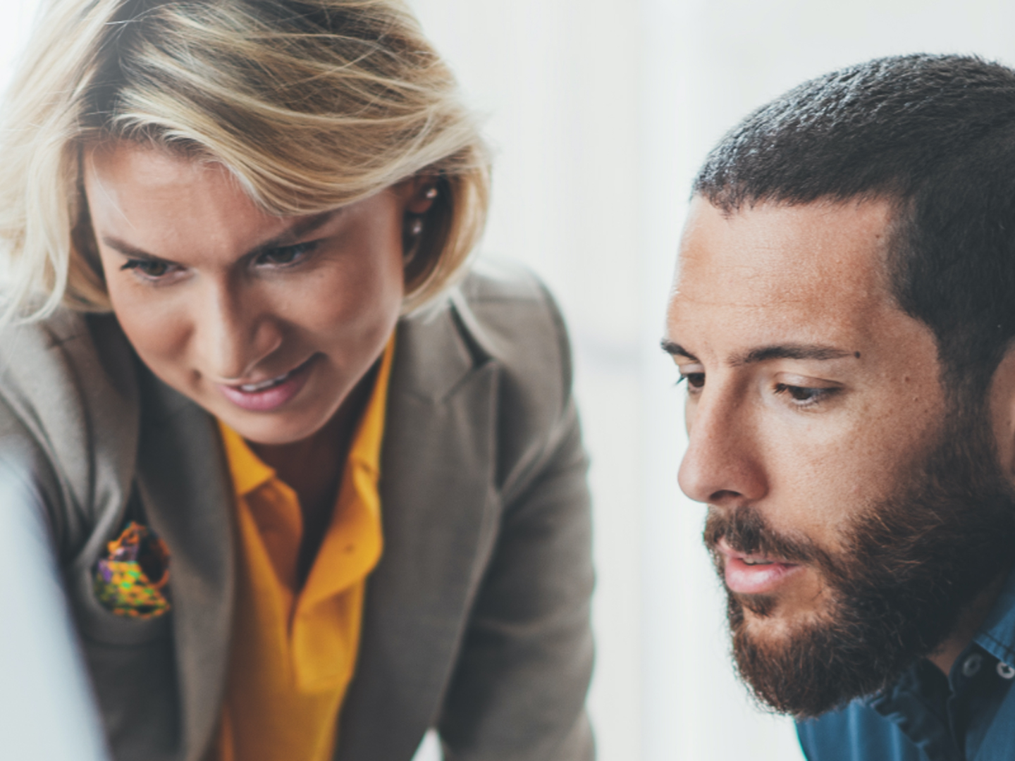 Man and woman looking at documents.