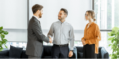 two men and a woman meeting about personal banking shaking hands
