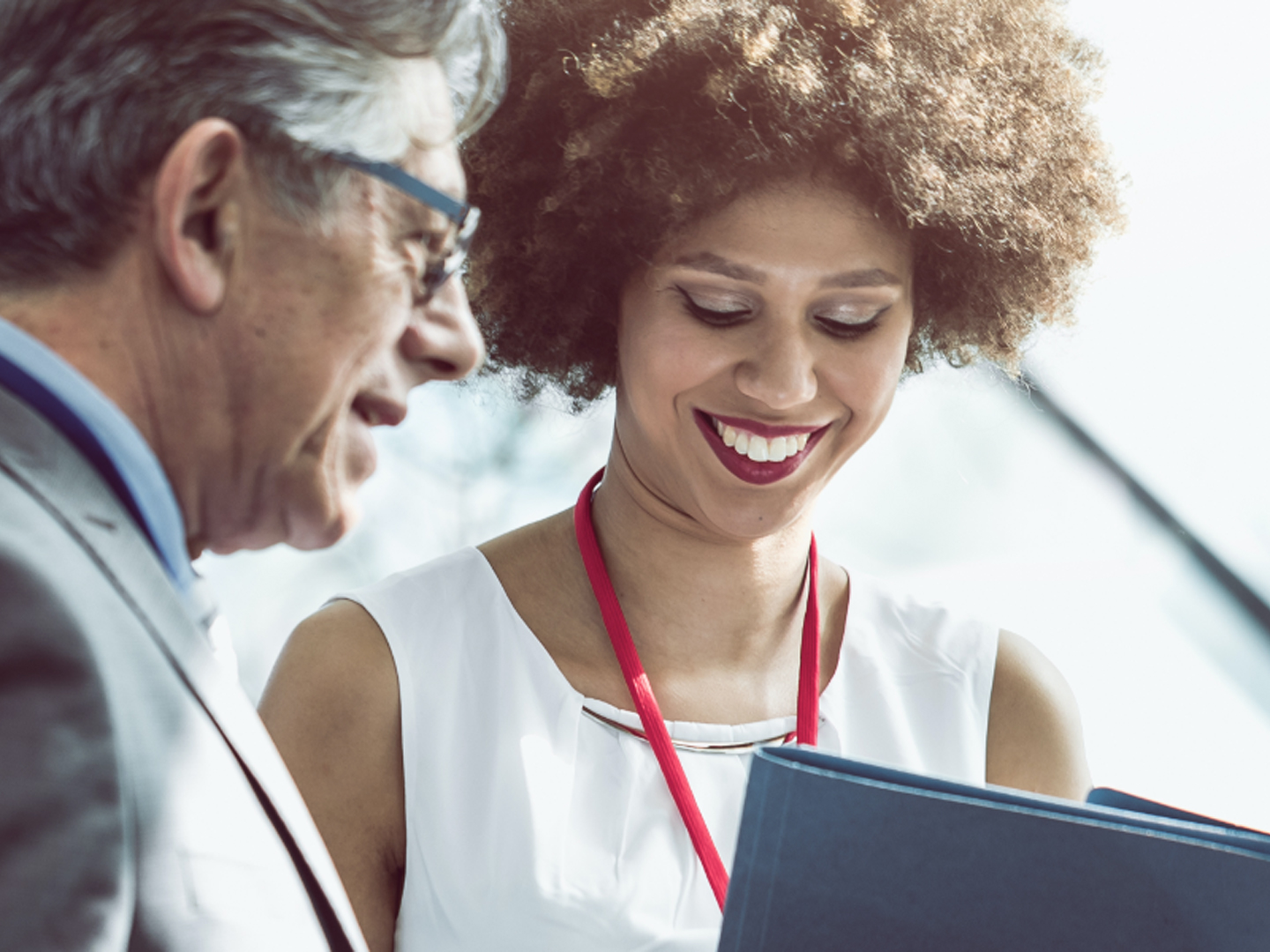 business man and woman looking at documents