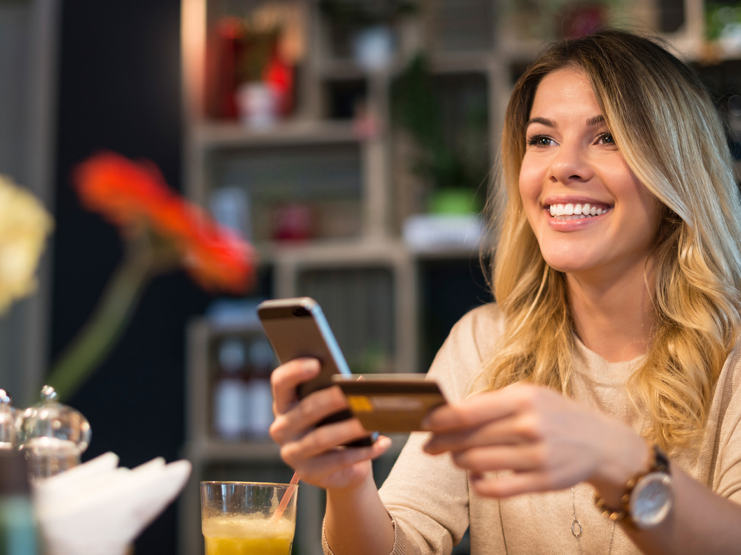 woman using mobile app to unlock debit card