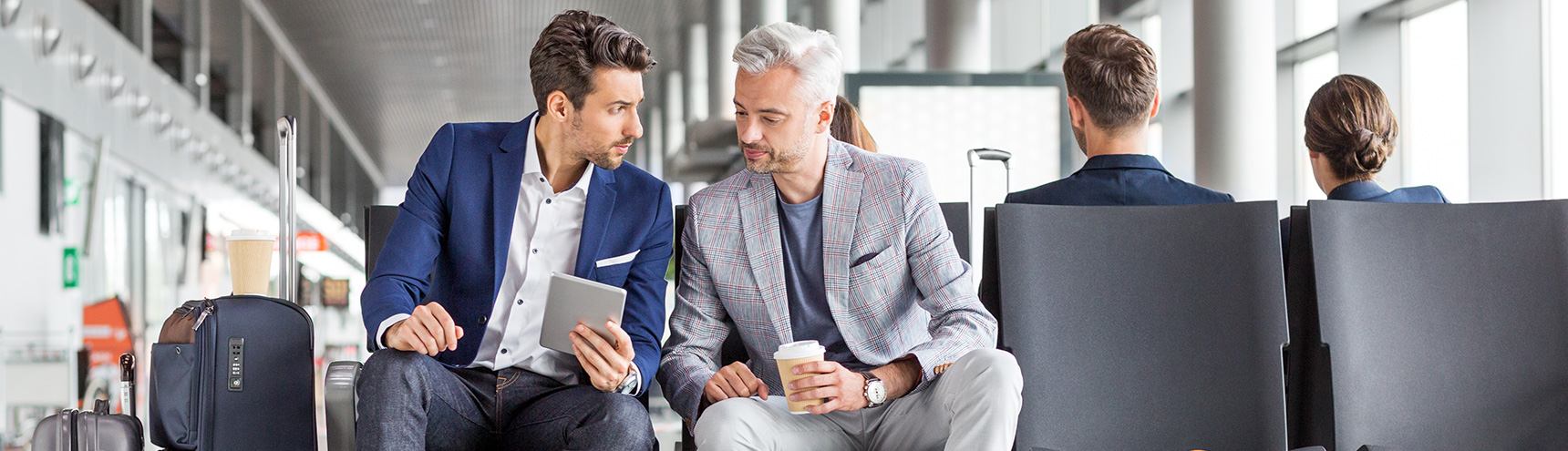 business men reviewing commercial card options online