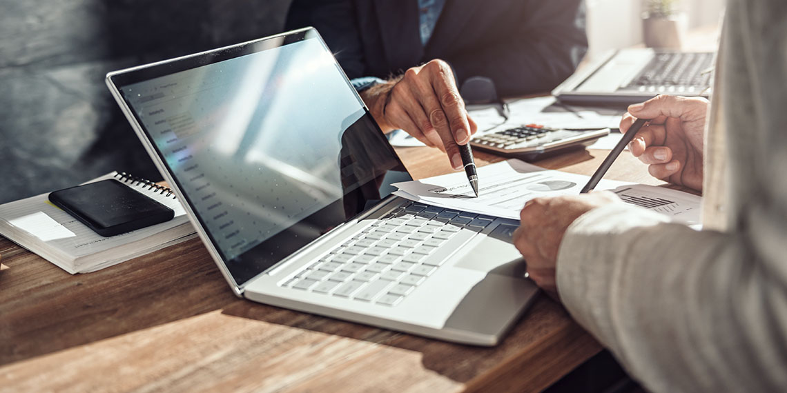 business abstract photo laptop and paperwork