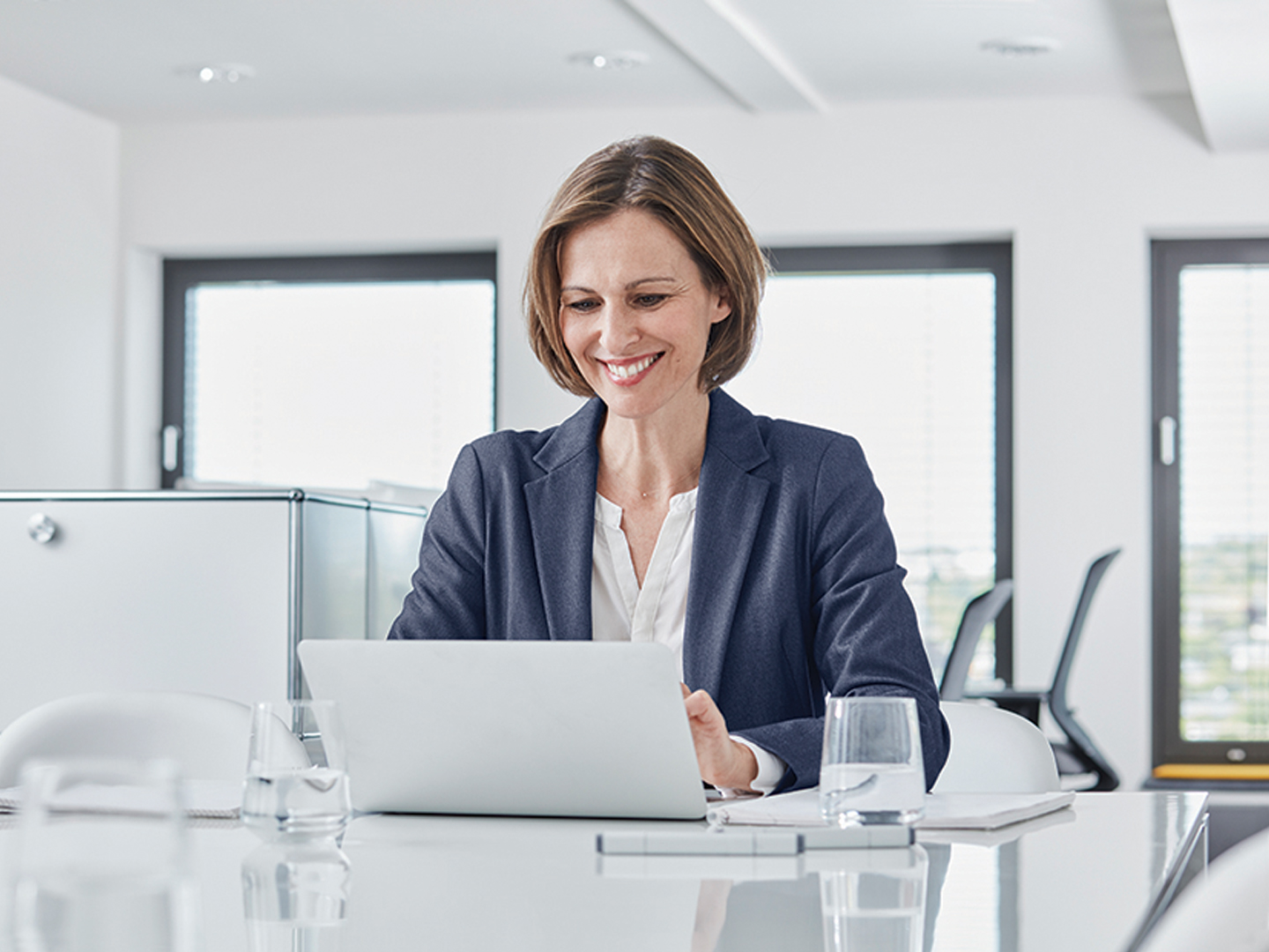 business woman in office using laptop