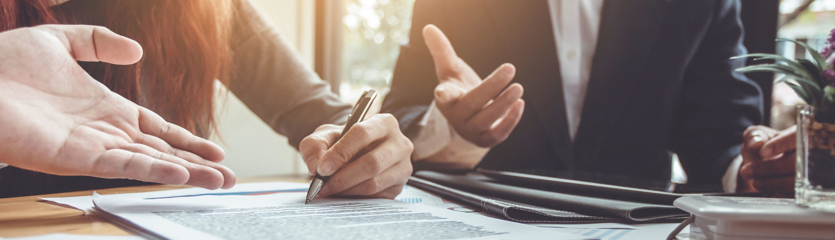 business people going over documents in office