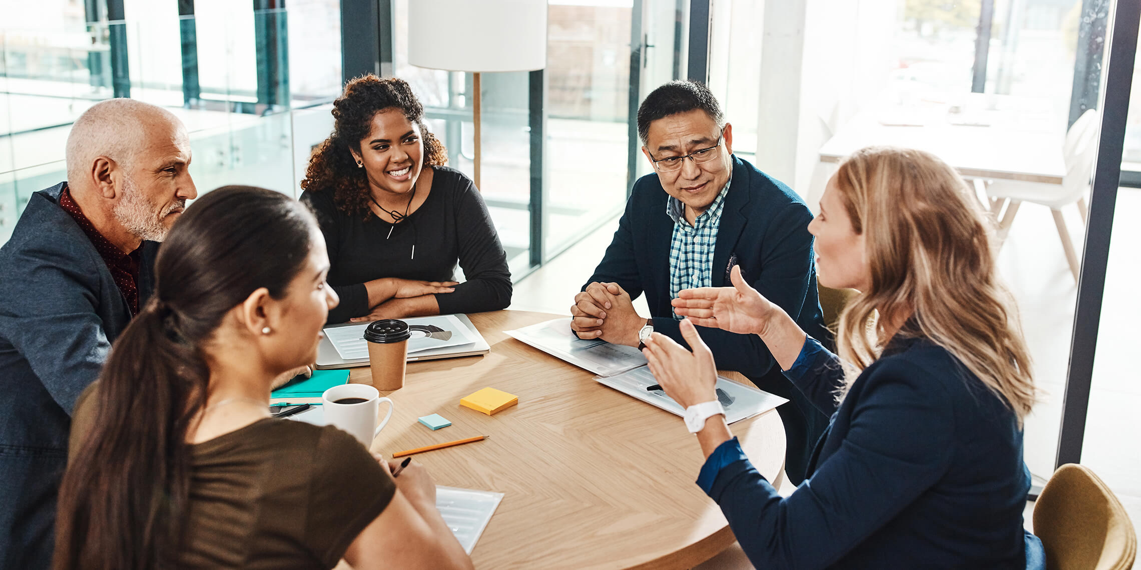 small business reviewing marketing strategy at round table