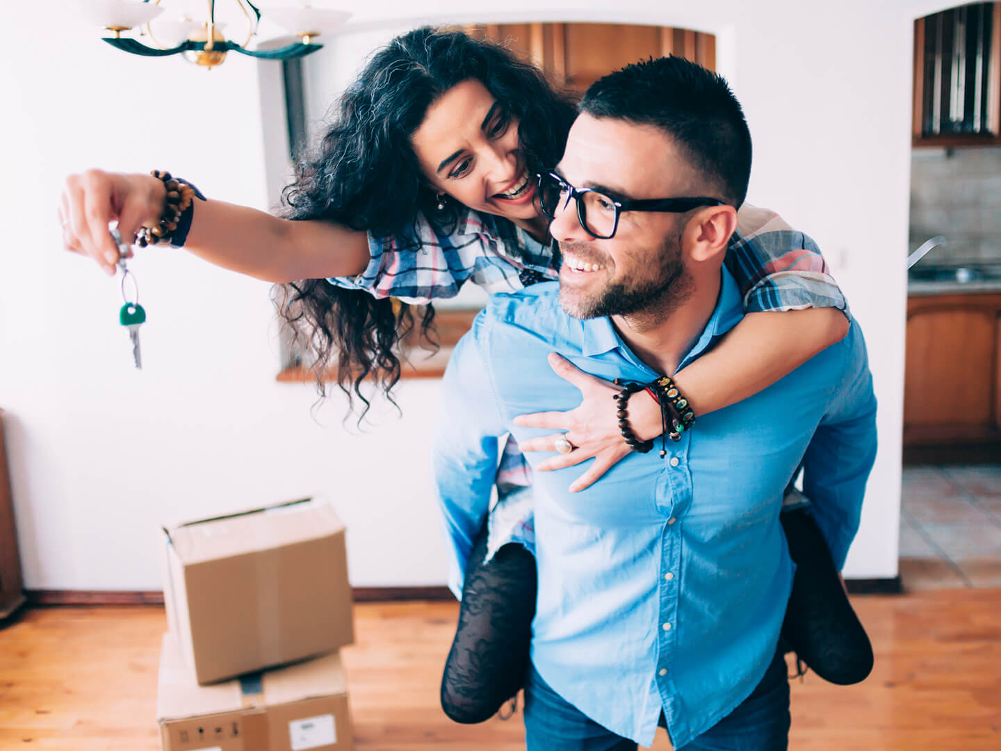 young couple celebrating in new home