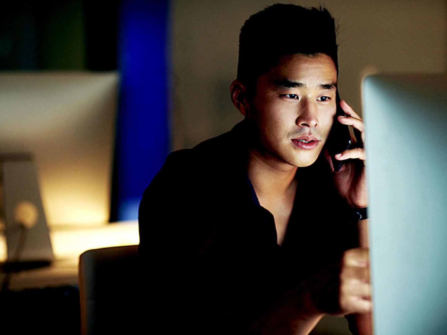 A man in front of his computer