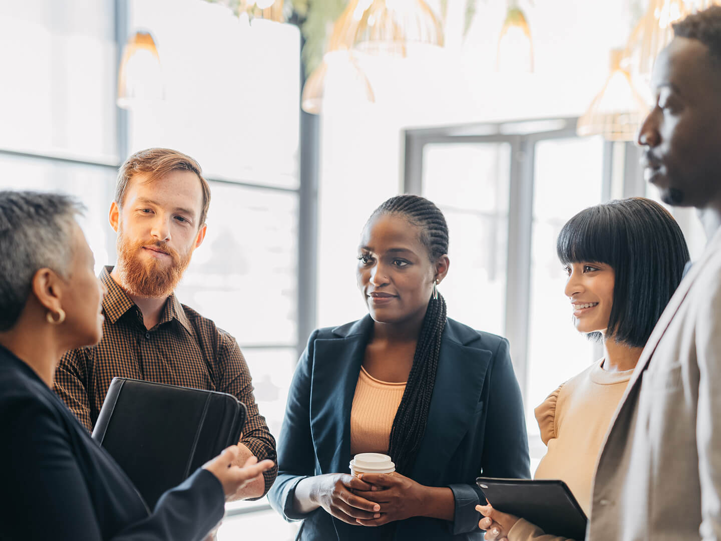 female leader or manager talking with staff in an office setting