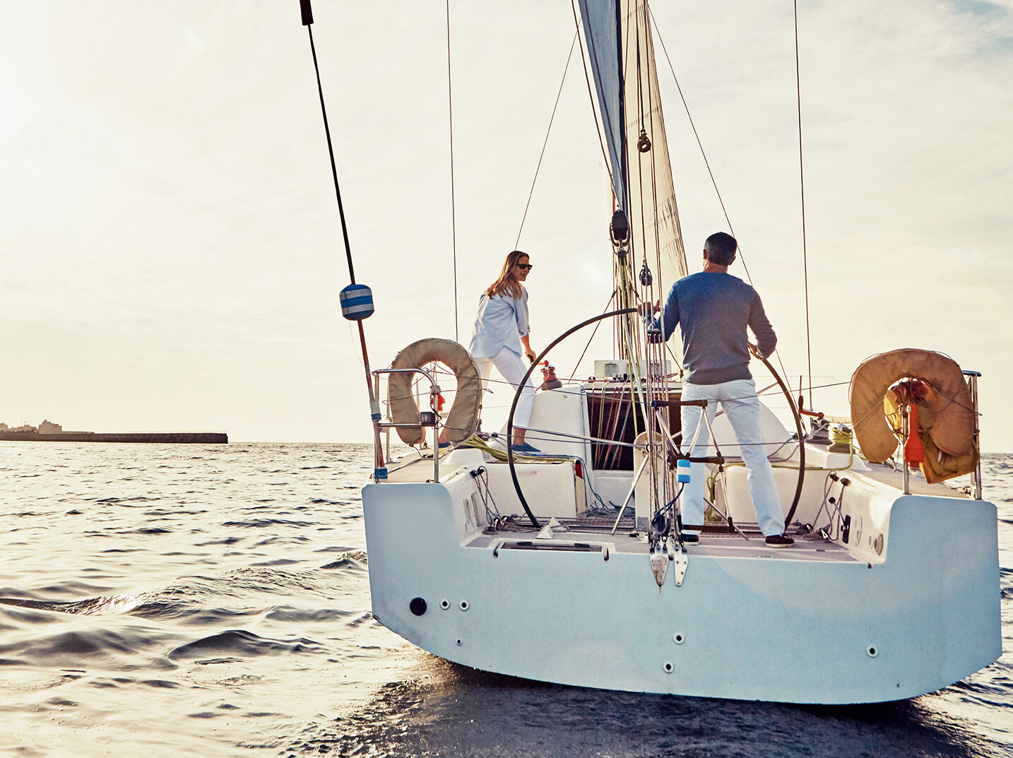 Image of a couple out sailing on a yacht