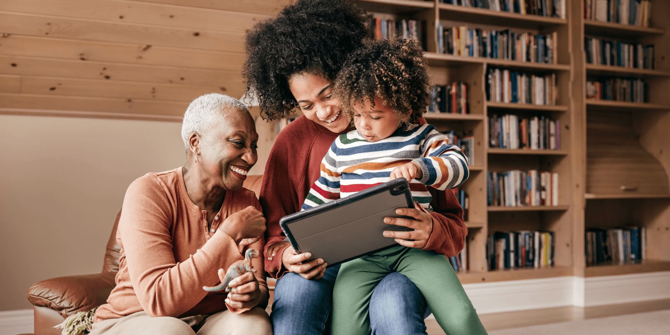 multi-generational family playing on laptop in in-law apartment