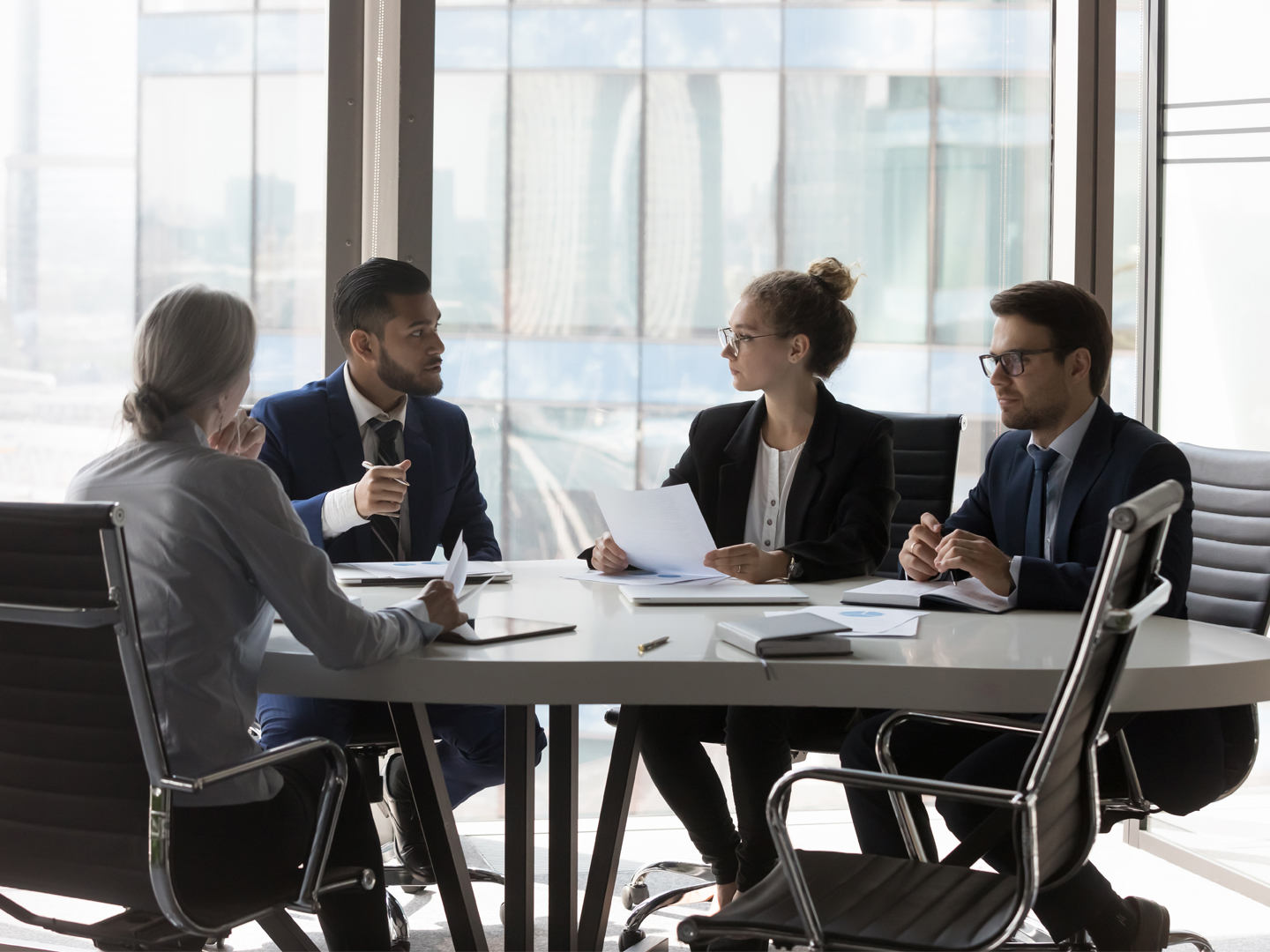 Colleagues sitting at conference room table