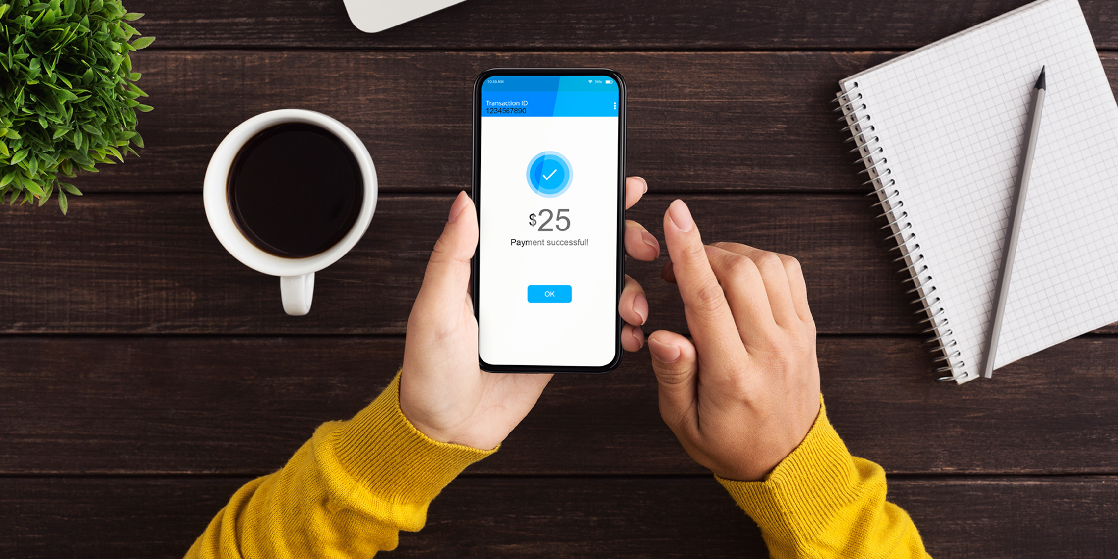 Woman making payment with mobile phone